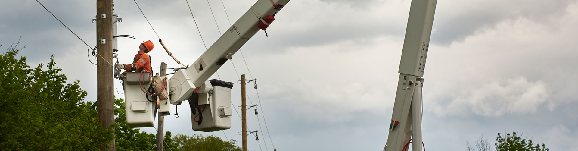 utility workers working on powerlines